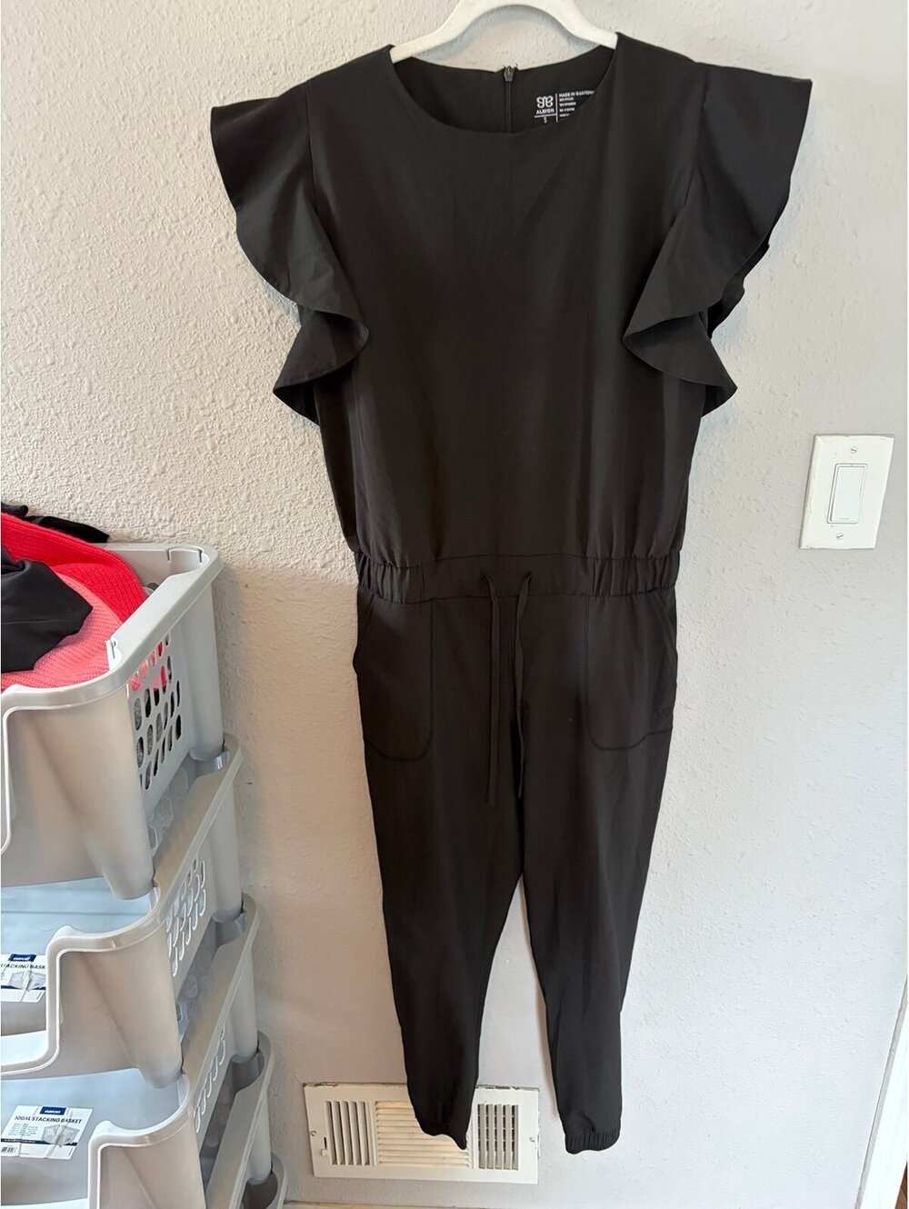 Albion Fit 9 to 9 Black Jumpsuit S. On website for $128.